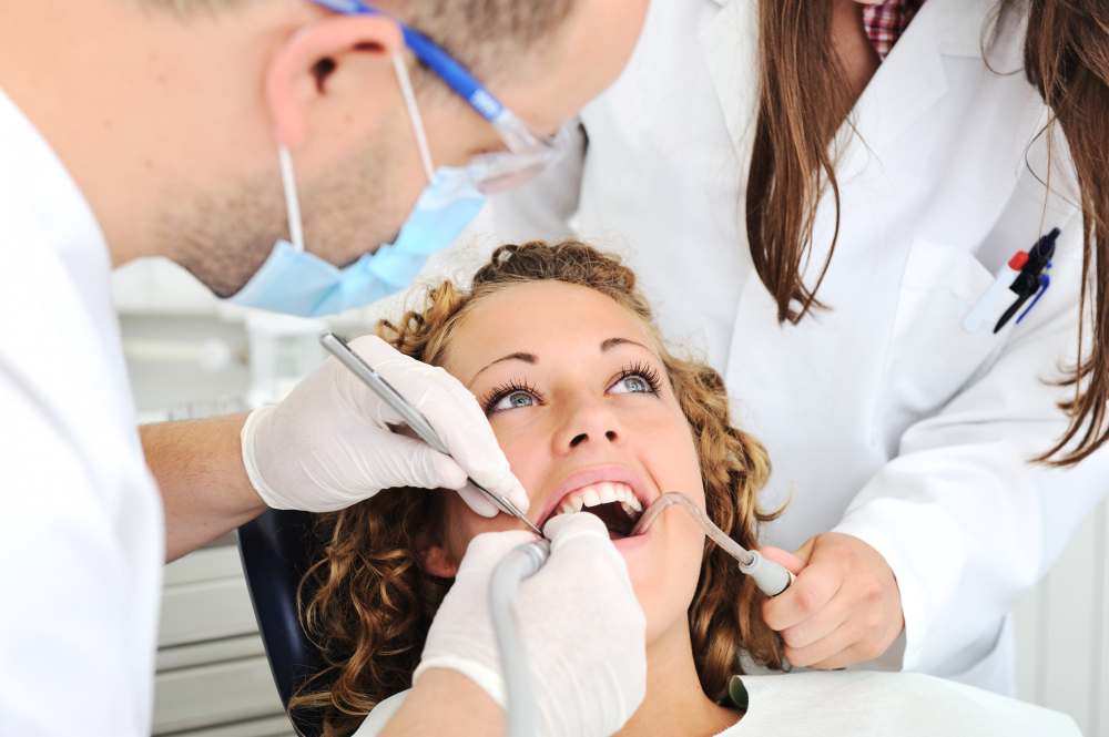 woman in dental chair receiving a check up