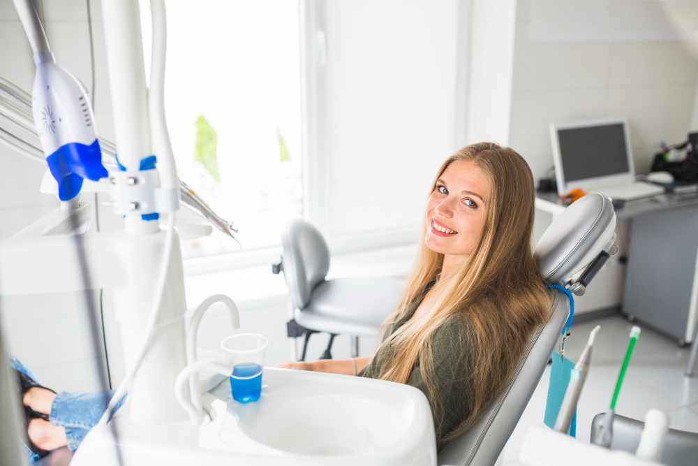 girl sitting in dental chair smiling
